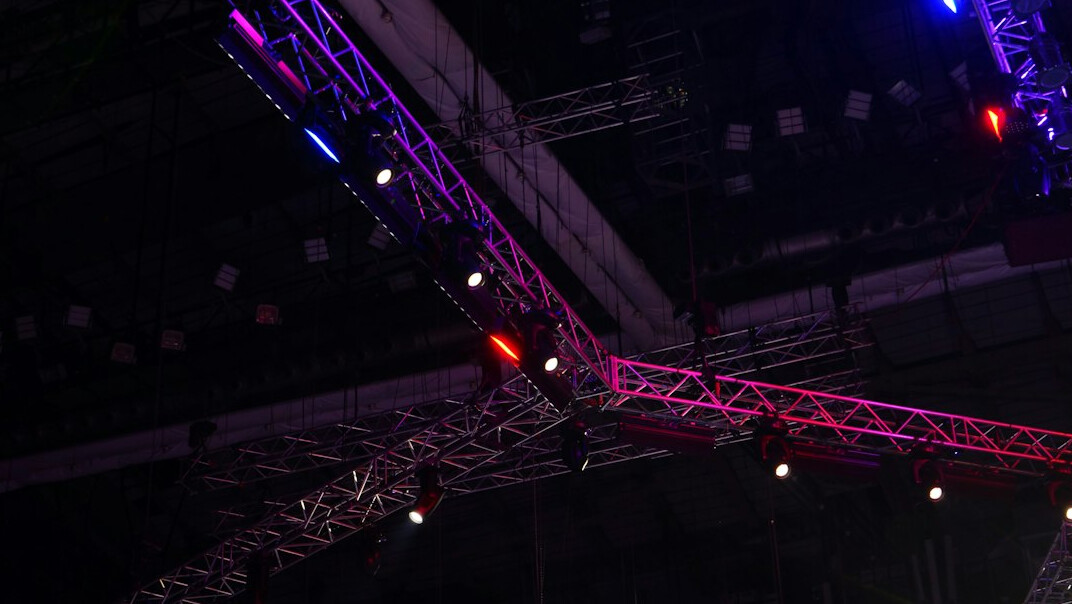 Stage lighting rig above a live event